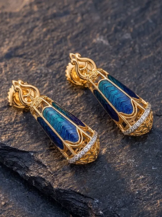 Lantern-inspired earrings crafted in 925 gold-plated silver, featuring deep blue and green champlevé enamel, intricate detailing, and Swarovski crystals