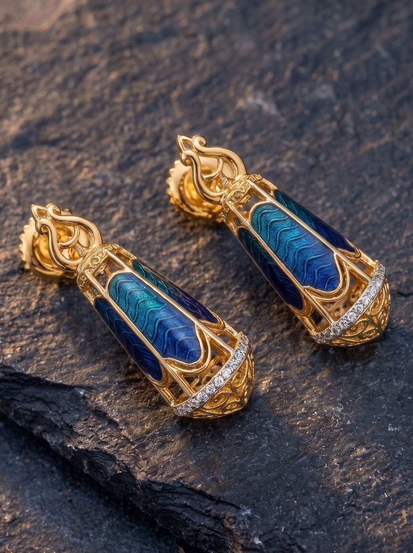 Lantern-inspired earrings crafted in 925 gold-plated silver, featuring deep blue and green champlevé enamel, intricate detailing, and Swarovski crystals