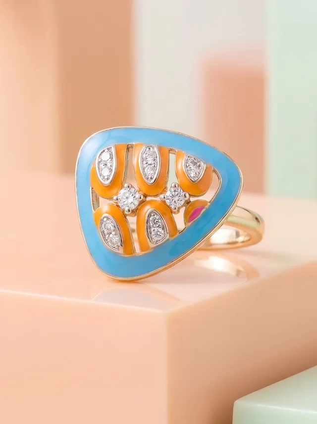 A contemporary ring inspired by the beauty of oceanic patterns, featuring vibrant cloisonné enamel in azure blue, sunlit amber, and vibrant fuchsia accents. Crafted in 925 silver with gold plating and adorned with sparkling Swarovski crystals, it is a bold expression of colour and contemporary elegance.