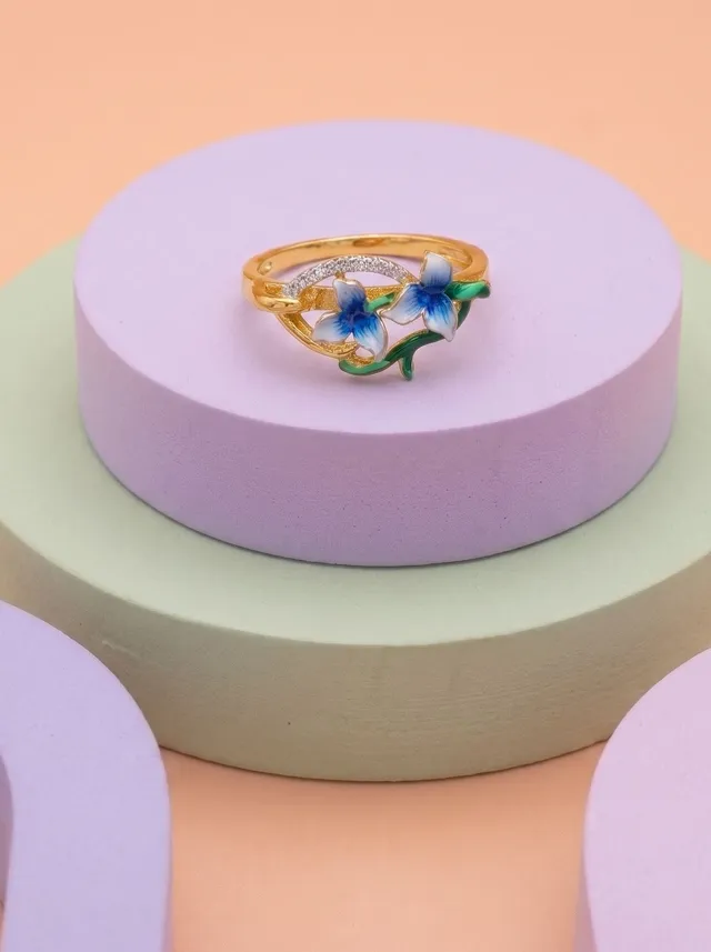 A graceful ring where delicate blue blossoms intertwine with flowing vines, creating a canopy of nature beneath an endless sky. Crafted in 925 silver, finished with gold plating and vibrant cloisonné enamel, it is a timeless expression of serenity and elegance.